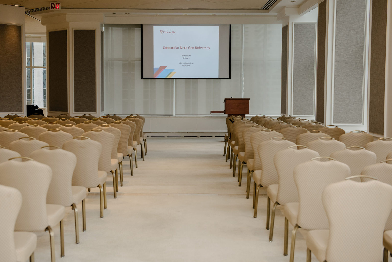 The presentation setup with rows of chairs and a projector with powerpoint presenation